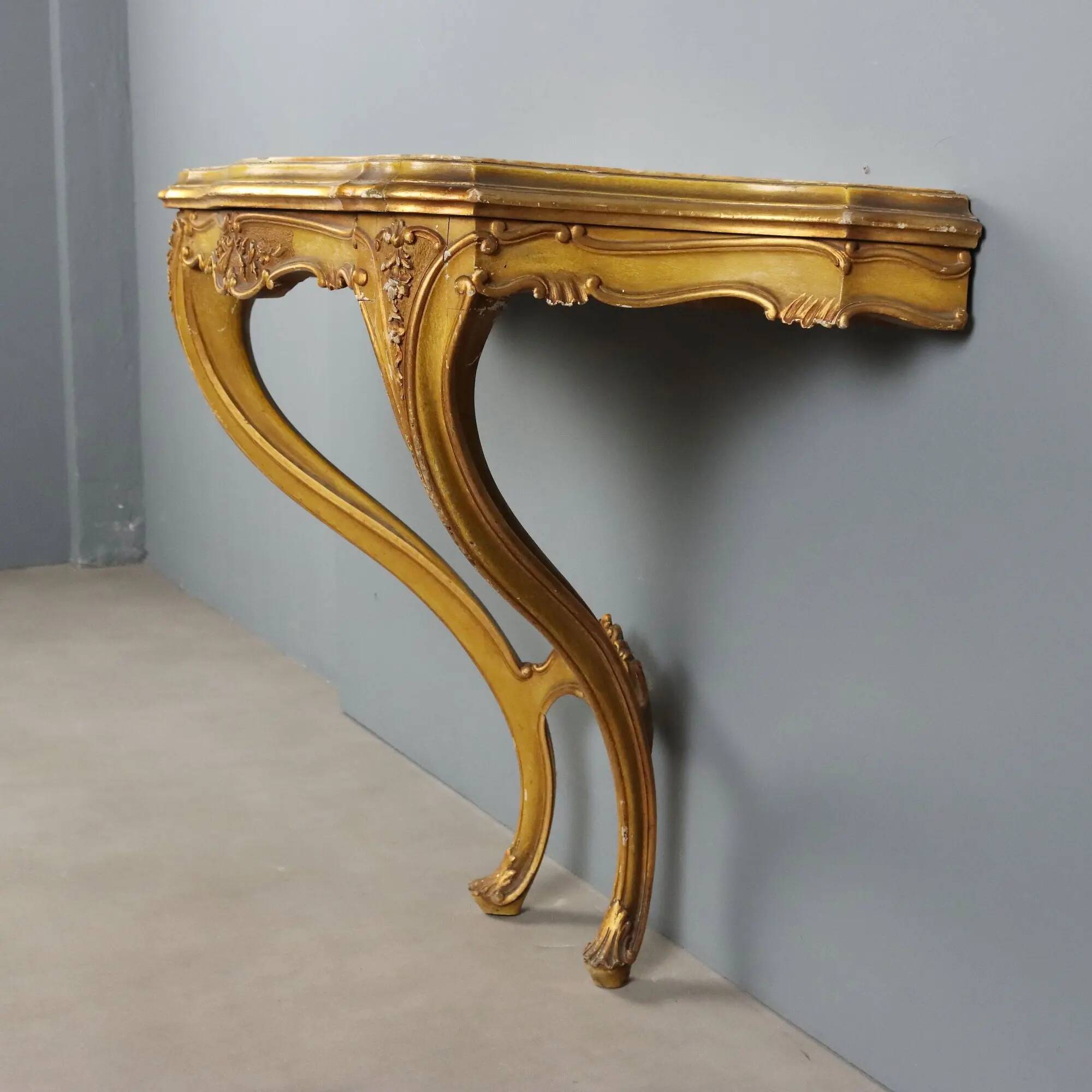 Antique console in carved gilded wood and marble, Italy, 19th century.
