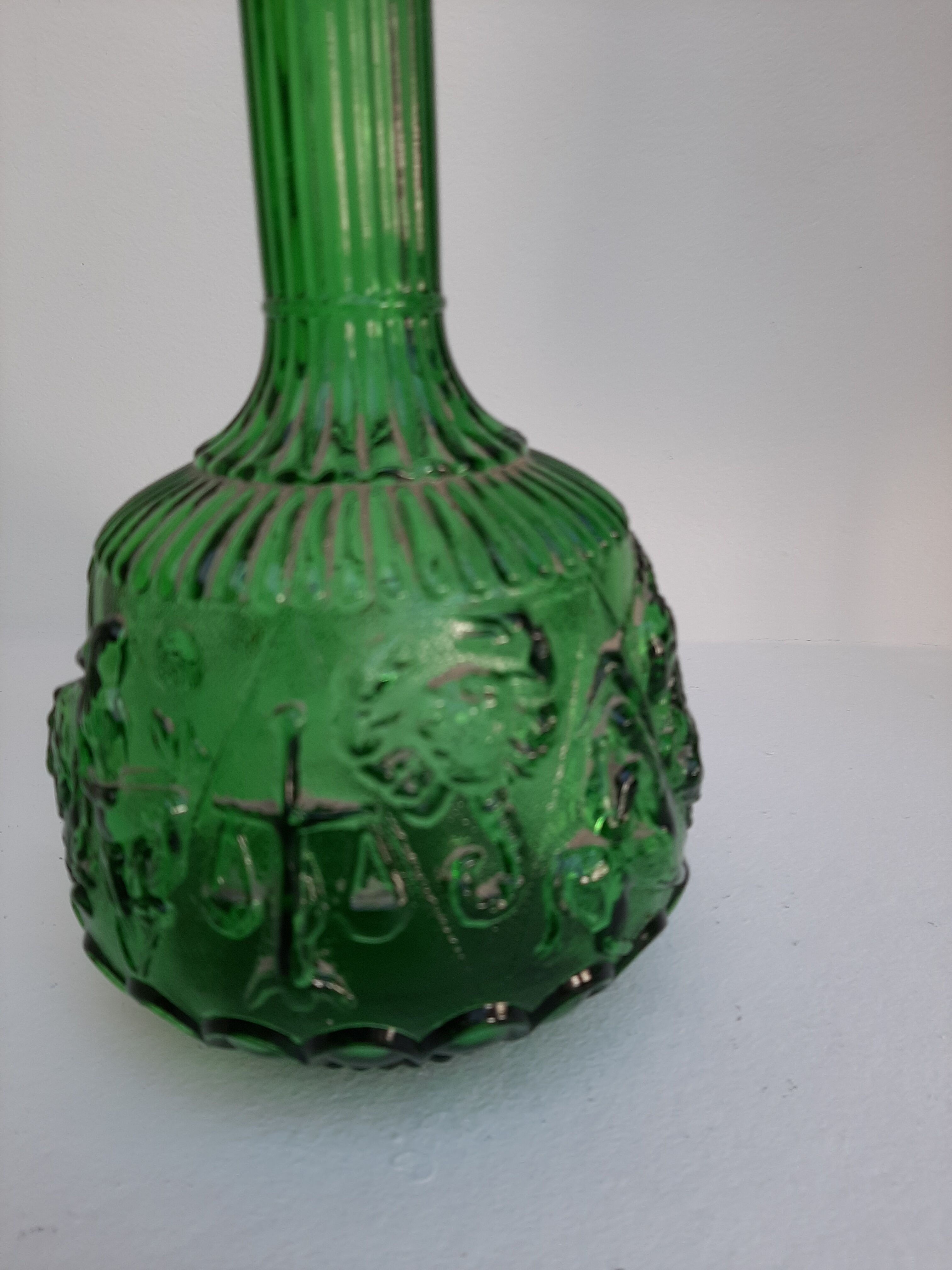 Empoli green glass bottle, zodiac signs