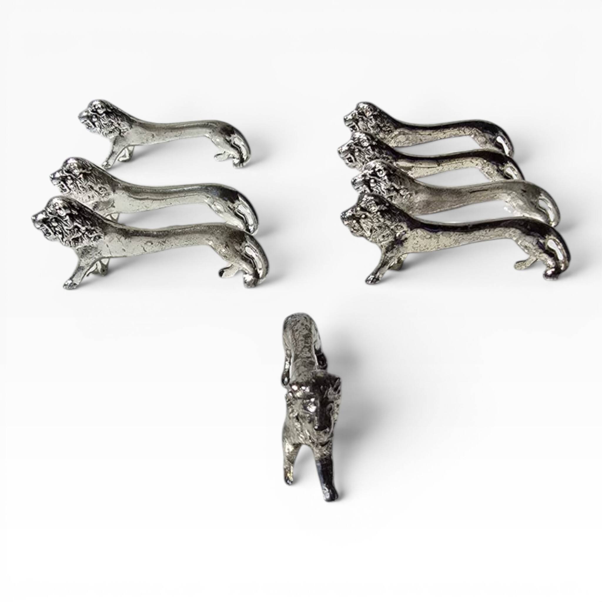 Series of antique knife rests in the shape of a lion, silver-plated metal.