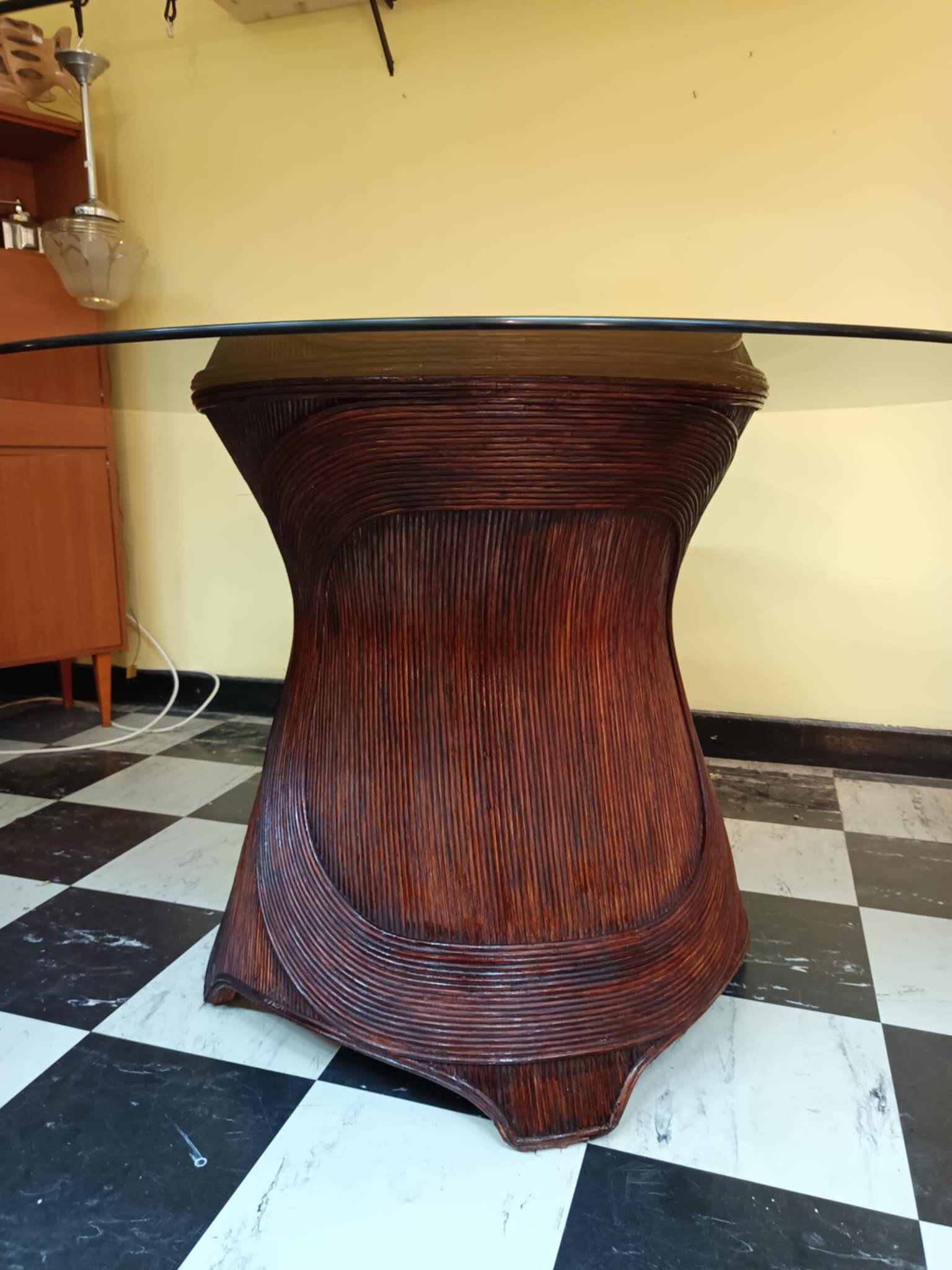 Dining table with rattan marquetry