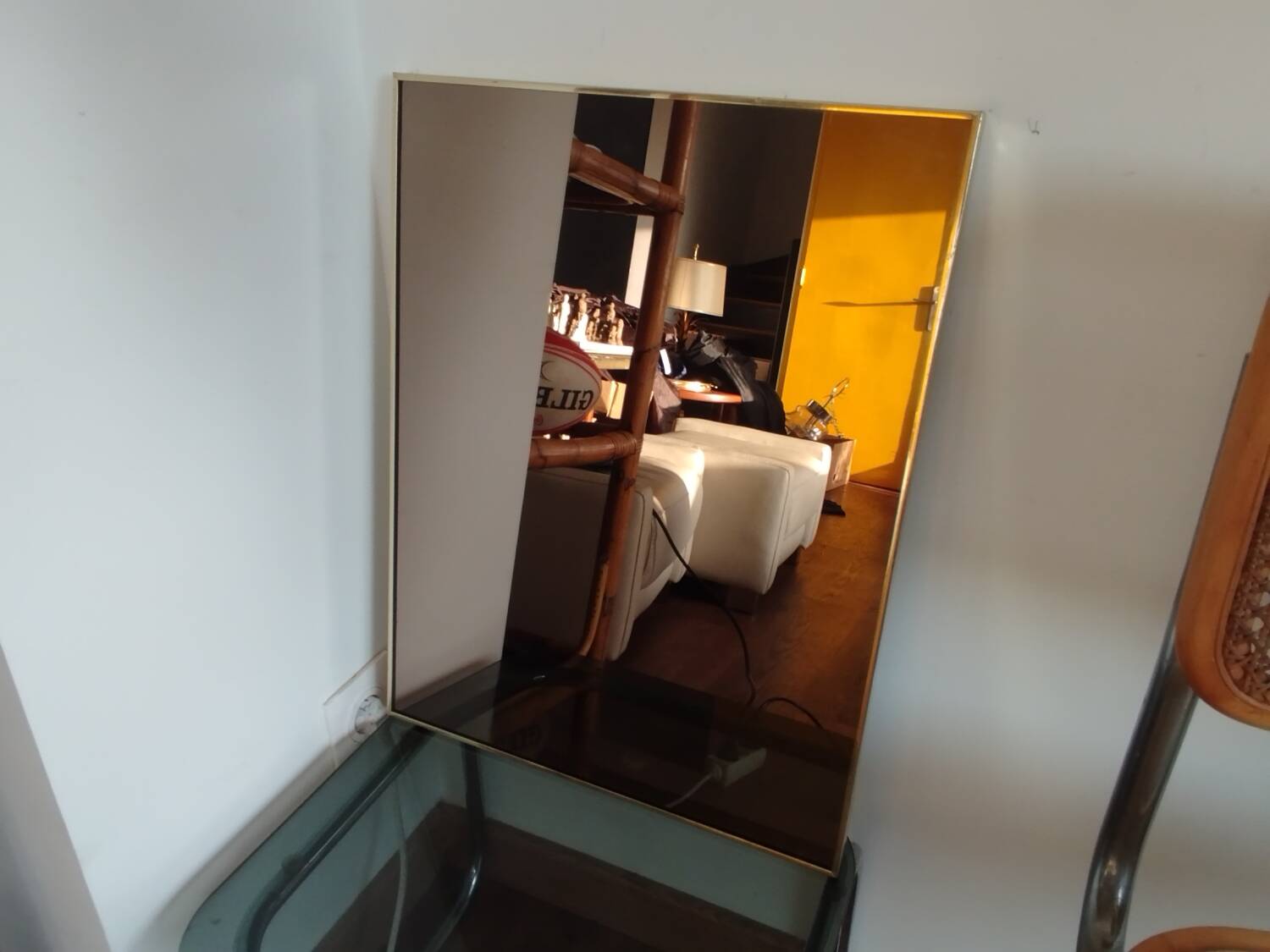Vintage mirror in gilded brass and smoked glass. circa 1970
