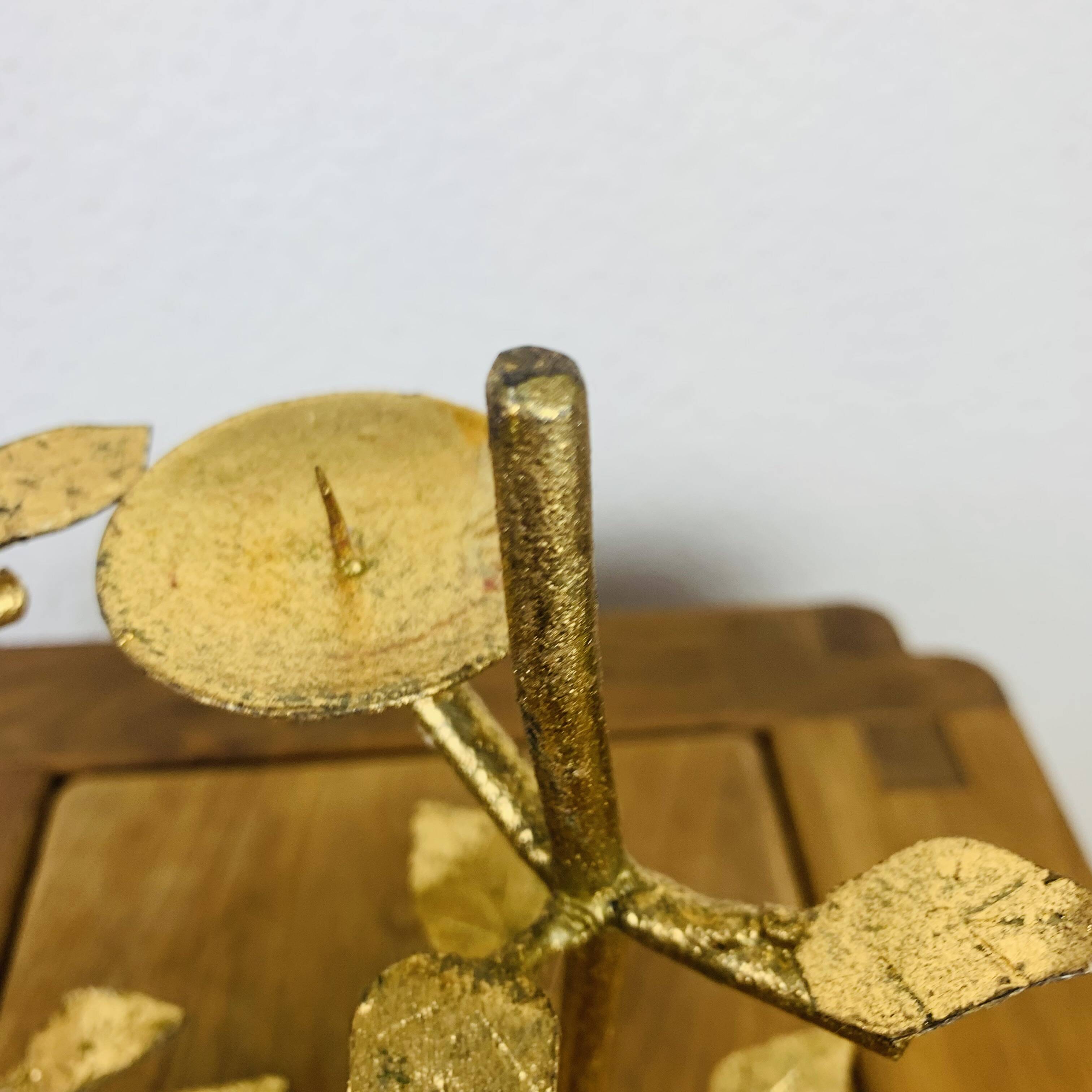 Pair of golden foliage candlesticks