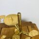Pair of golden foliage candlesticks