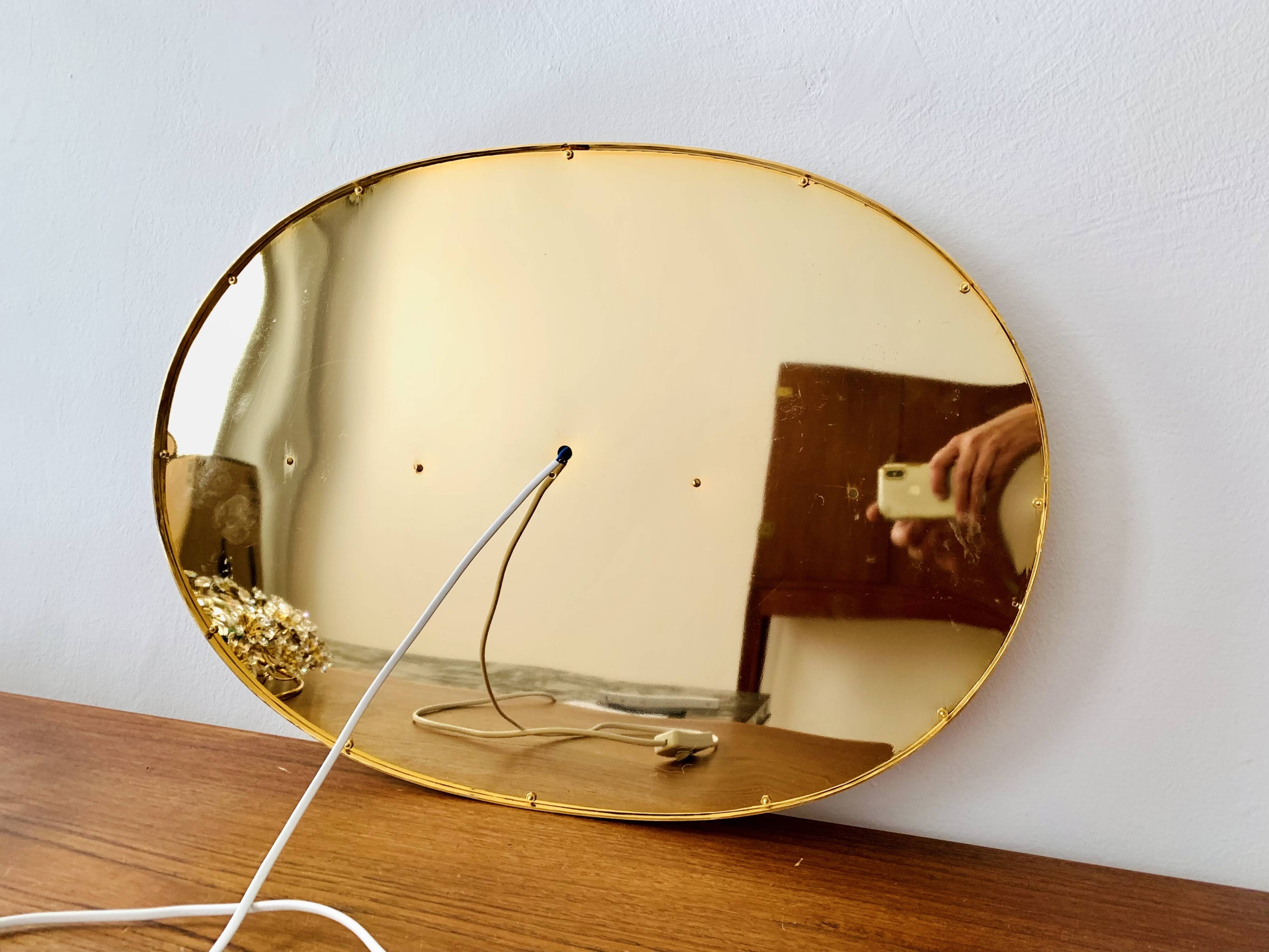 Illuminated floral mirror by Palwa