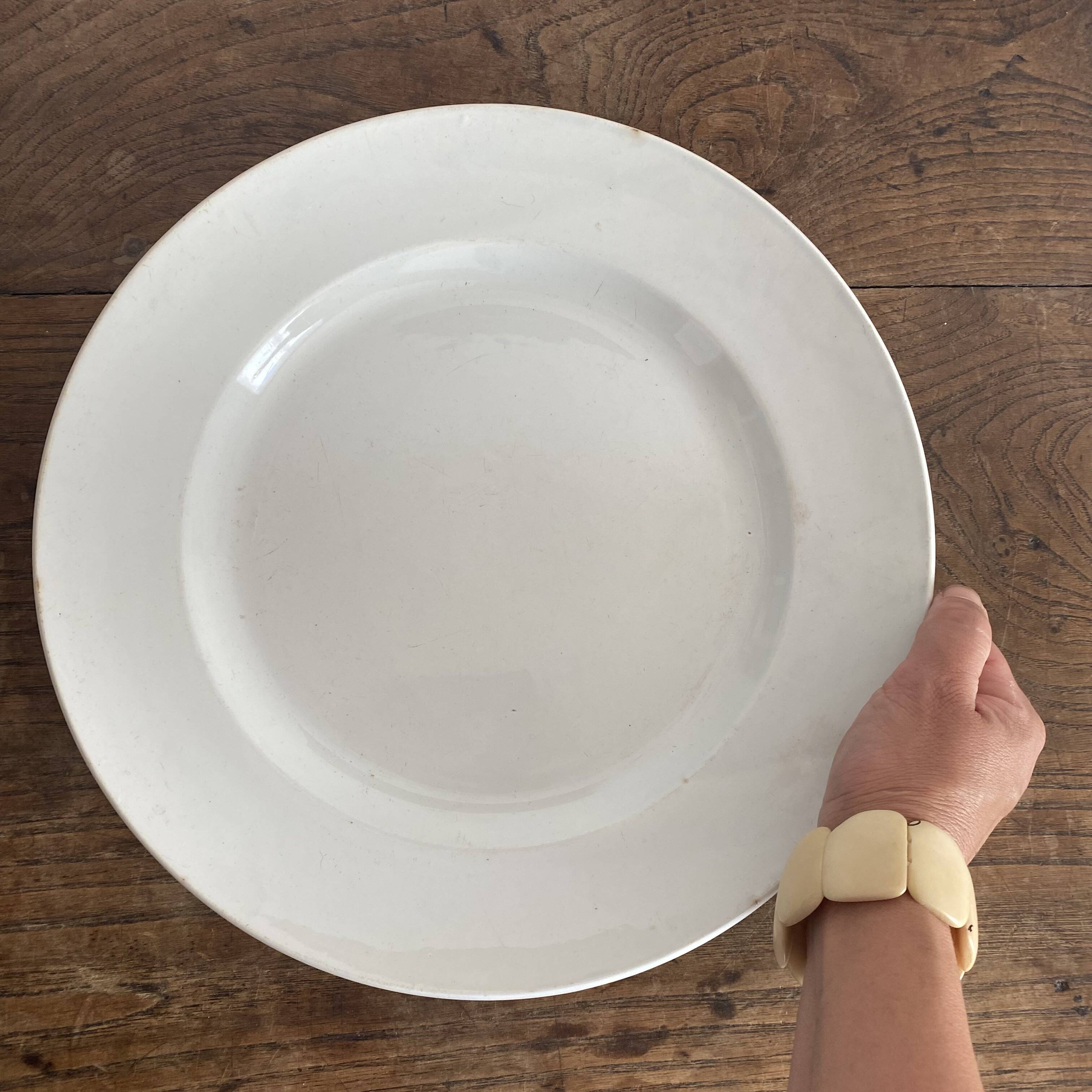 Set of large round white earthenware dishes from Creil and Montereau, 19th century