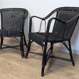 Paire de fauteuils noirs en rotin