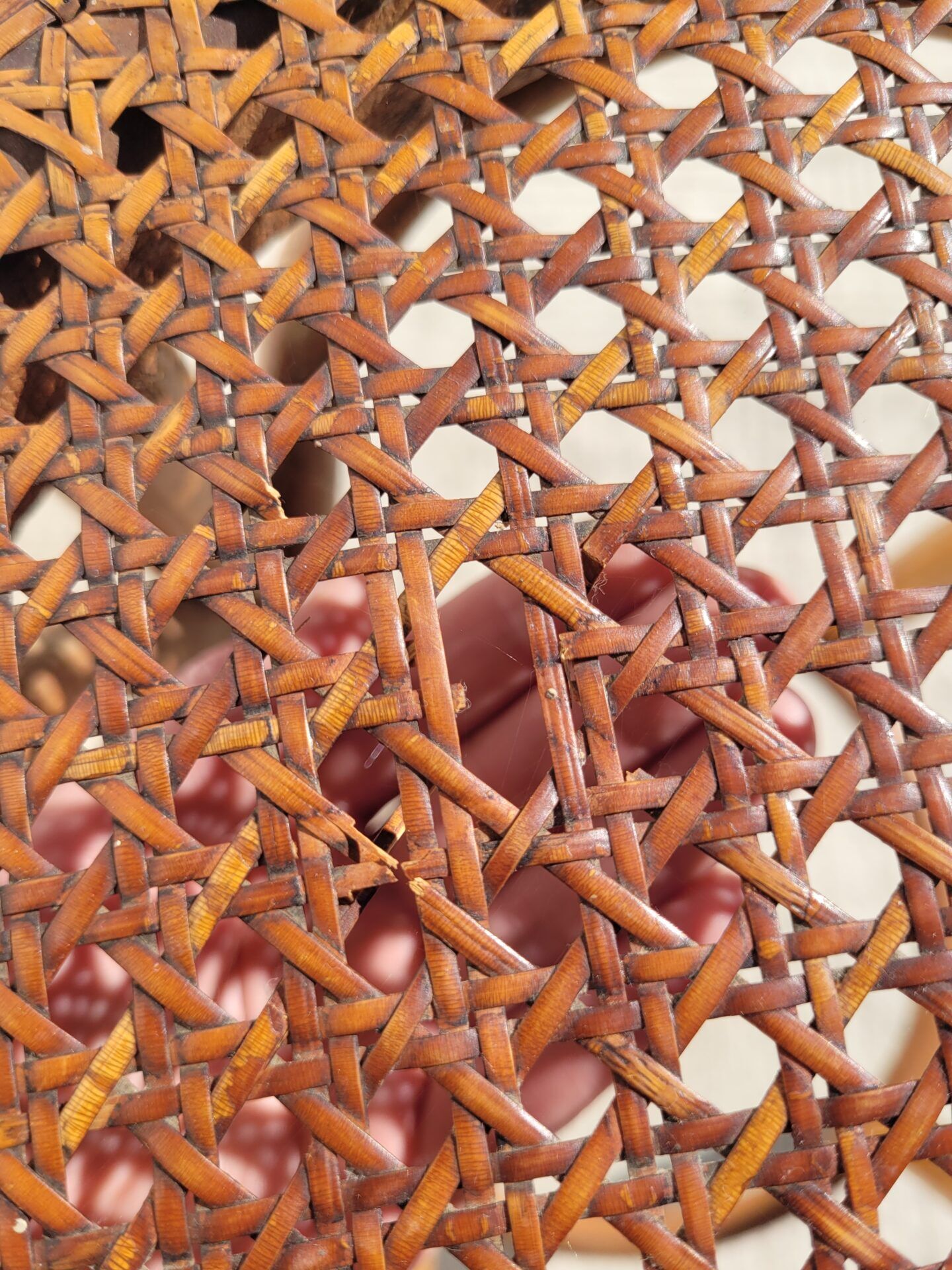 Old low caned bistro stool