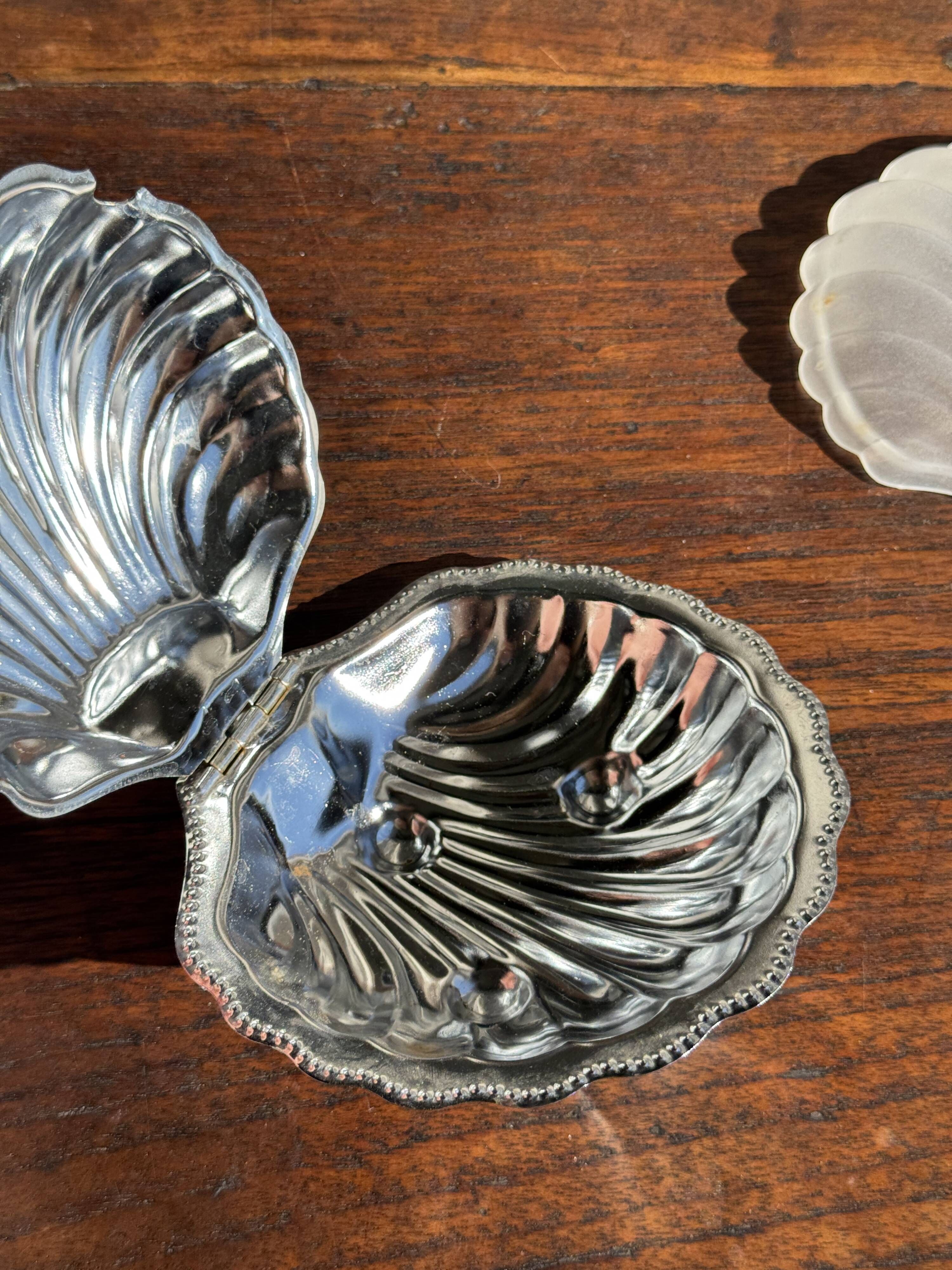Vintage silver-plated shell butter dish with transparent bowl.
