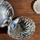 Vintage silver-plated shell butter dish with transparent bowl.