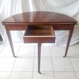 Mahogany game table and mahogany veneer, rolling half-moon console or round table.
