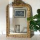 Golden fireplace mirror with pediment