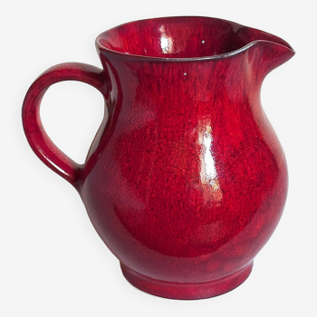 Vintage red enamel ceramic pitcher