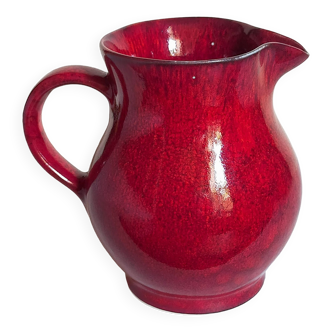 Vintage red enamel ceramic pitcher