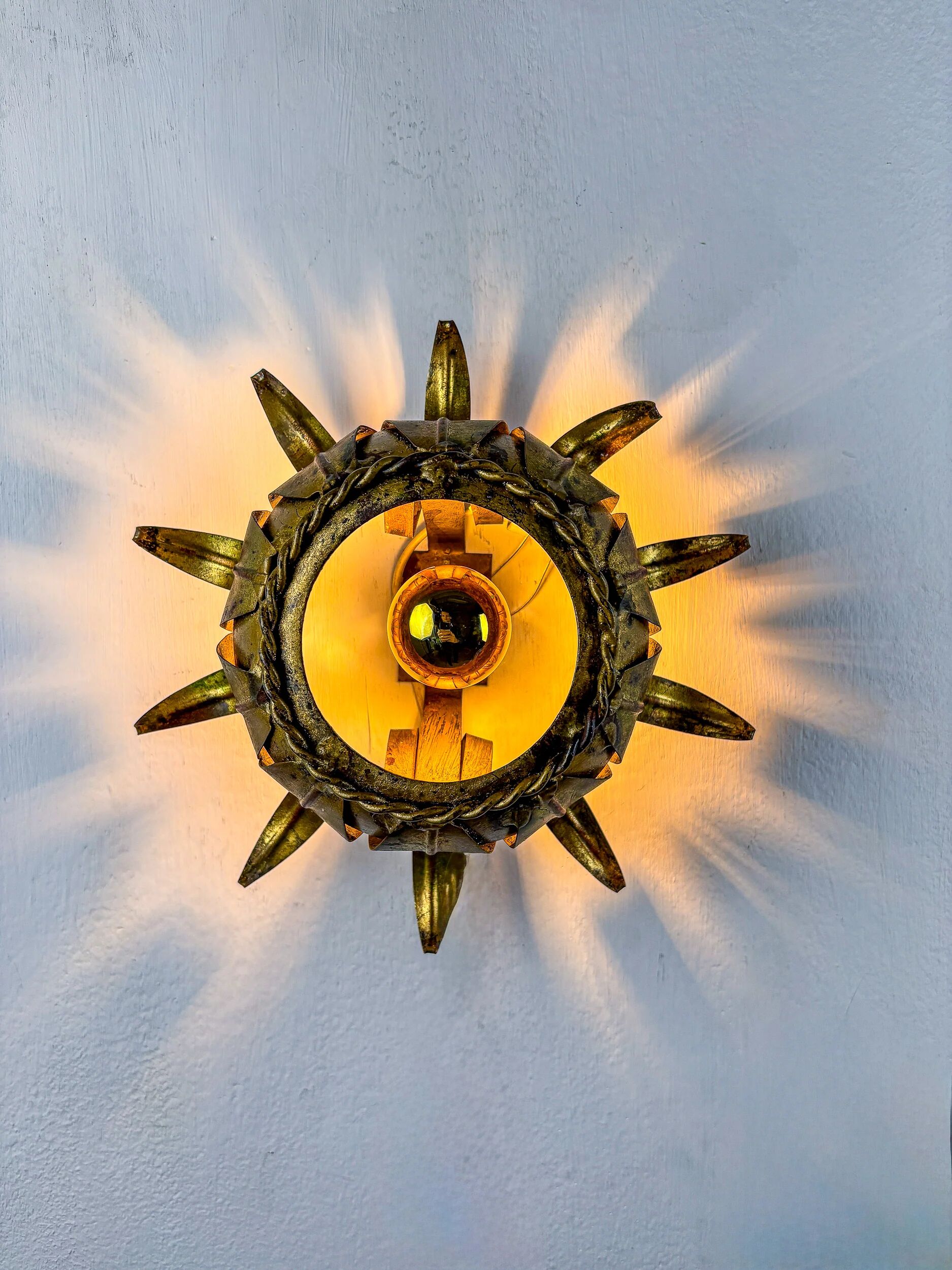 Sunburst ceiling light fixture or sconce in gilt wrought iron, Spain, 1960s