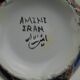 Piriform vase with a flared metal collar enamelled with a polychrome decoration, marked "Amini Iran" on the reverse.