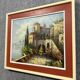 Italian School: painting of a castle on the edge of a lake