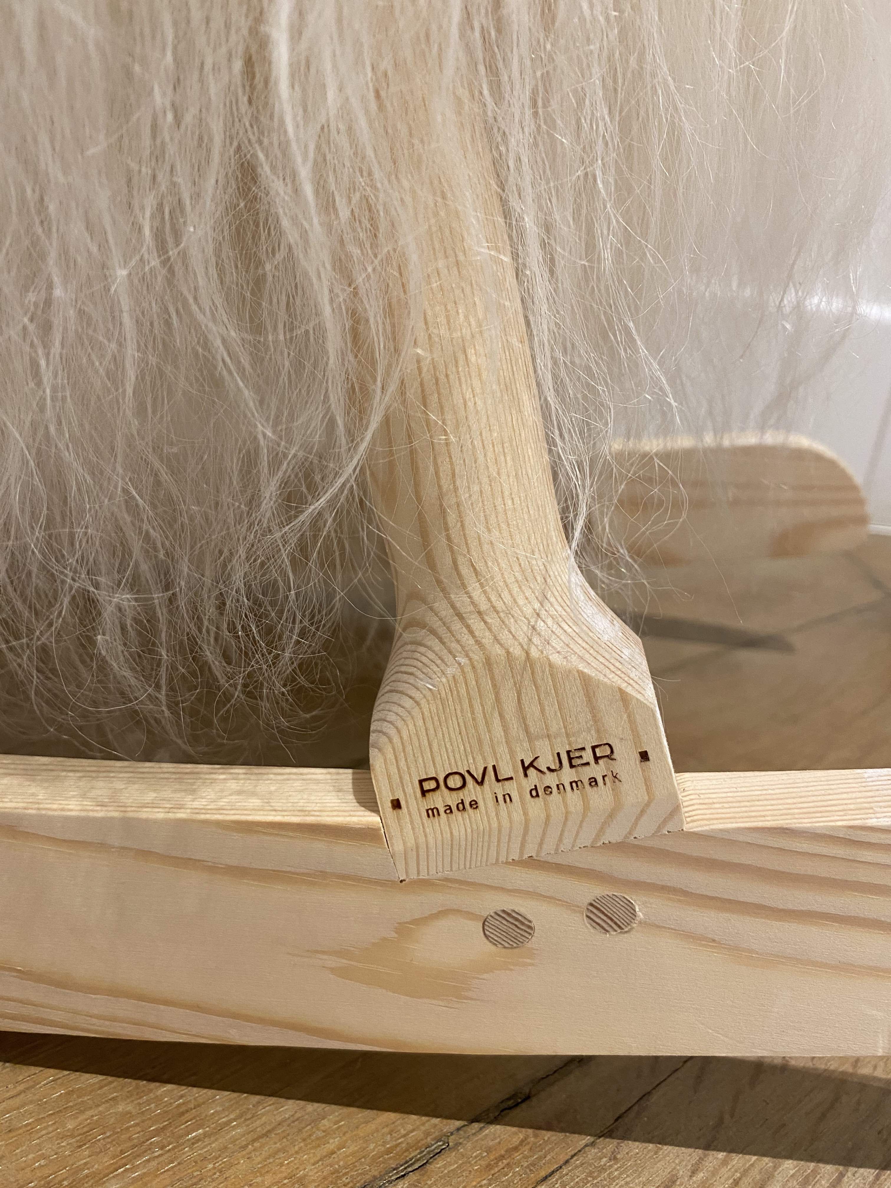 Wooden rocking horse and lambskin