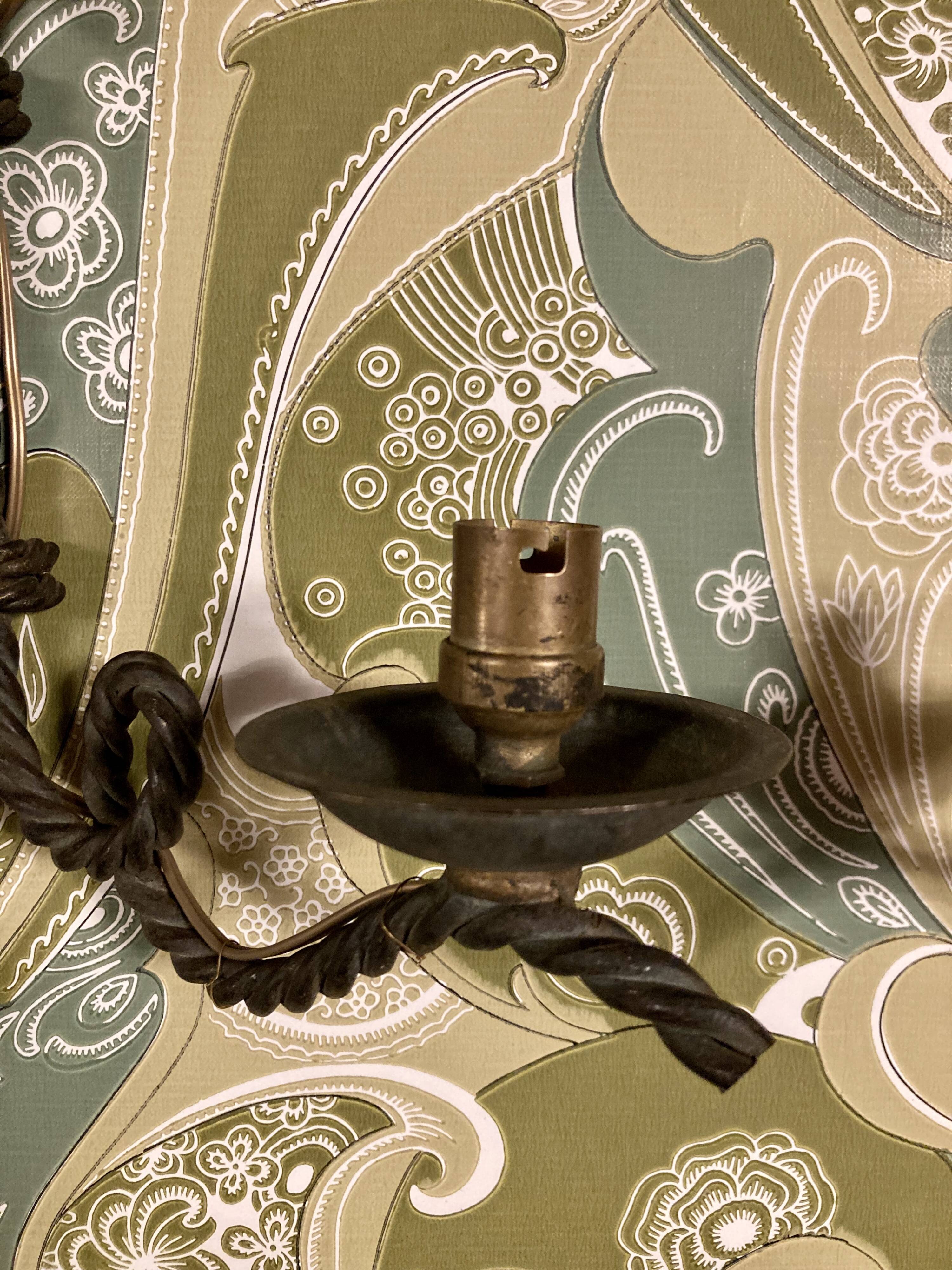 Pair of corded wrought iron wall lights