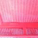 Fauteuil vintage en rotin rouge