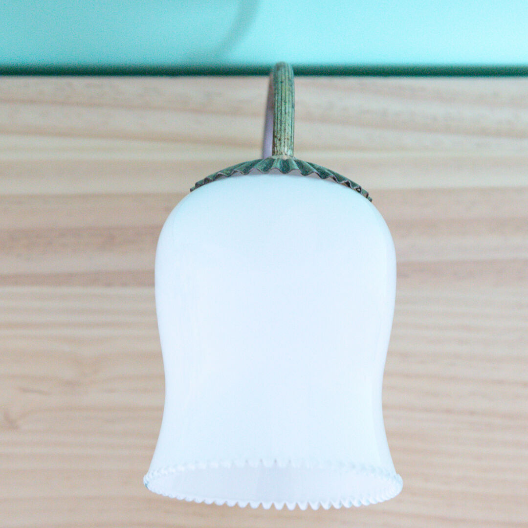 Metal wall lamp and serrated glass globe