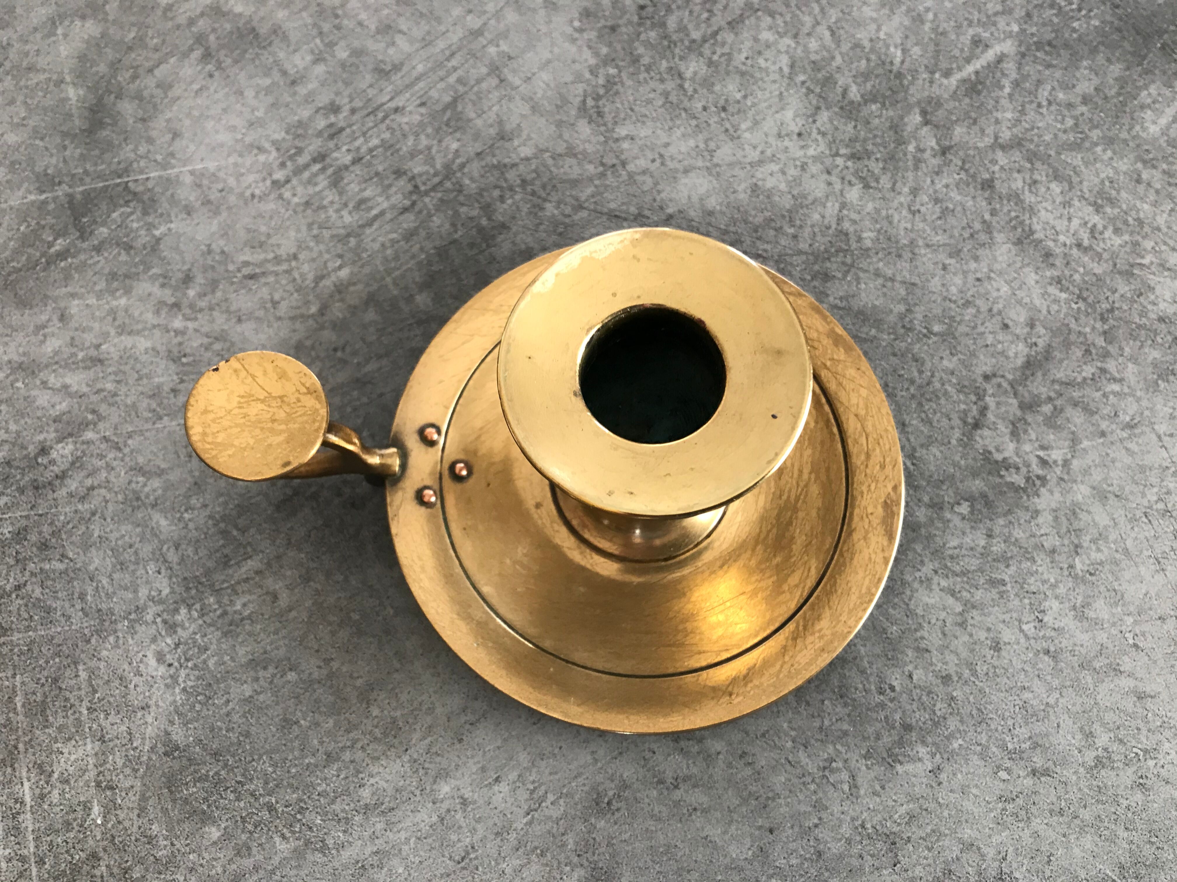 Hand candlestick in massive brasse