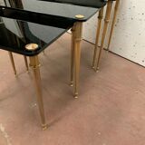 Pull out tables in brass and black glass XX century