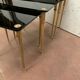 Pull out tables in brass and black glass XX century