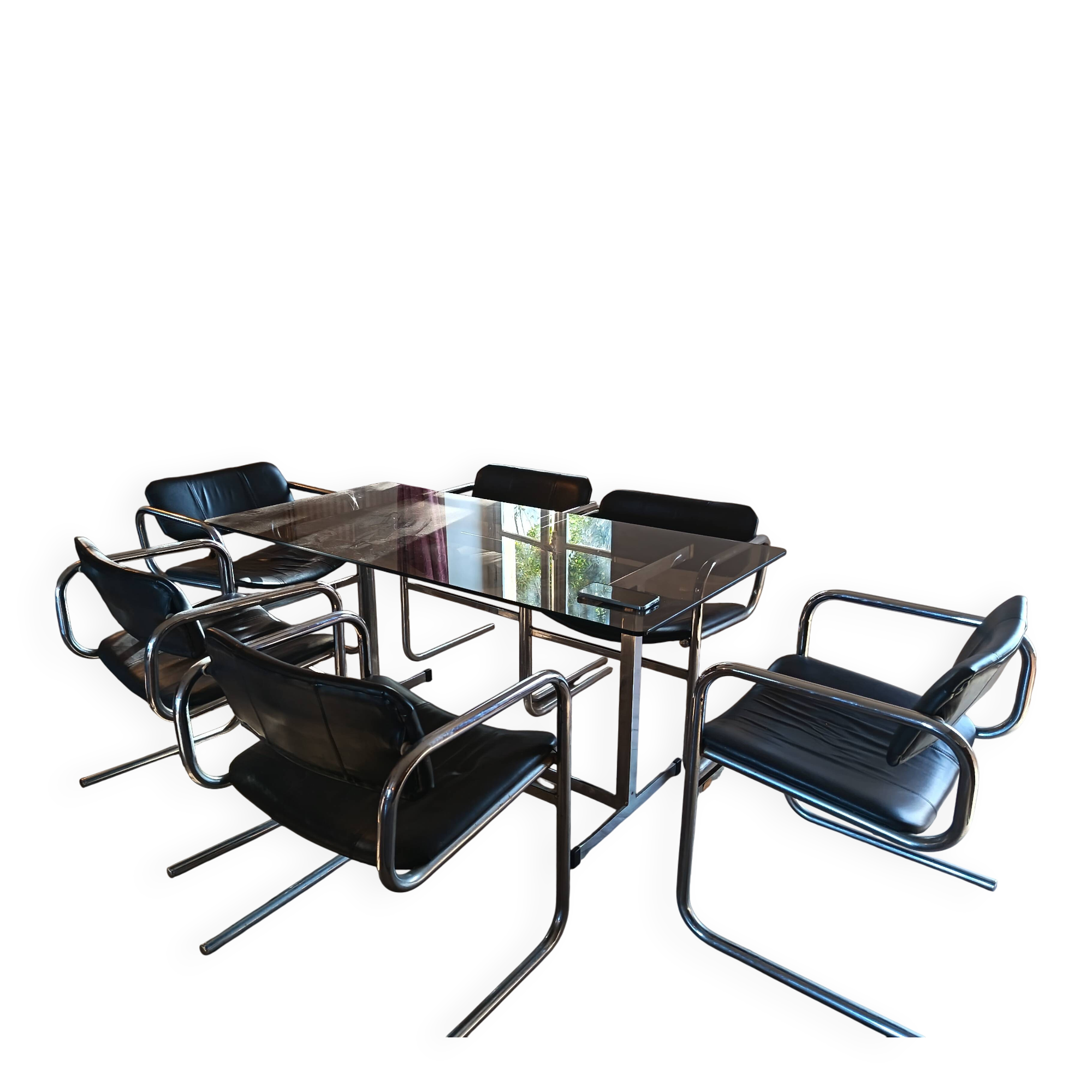 Dining table set with 6 Pieff chairs.