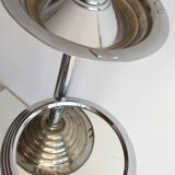 Ashtray and shelf on chrome metal stand.