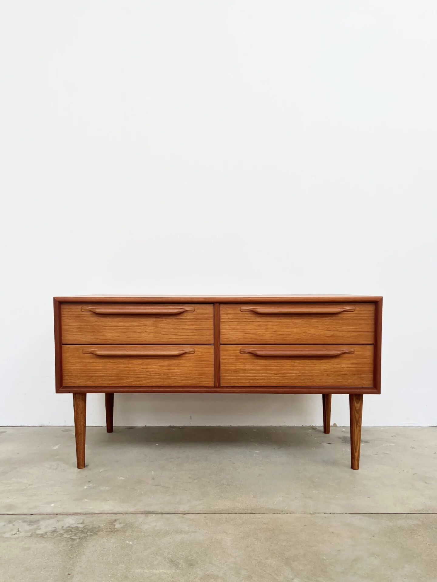 Lowboard teak 4 drawers — Mid-century lines, tapered legs, 1960s