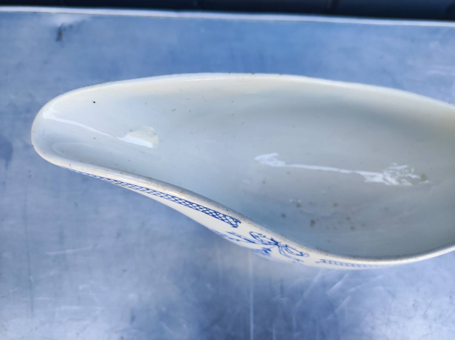 Old earthenware sauce boat