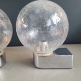 Pair of vintage wall lights in chrome metal with bubbled glass globes.