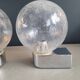 Pair of vintage wall lights in chrome metal with bubbled glass globes.