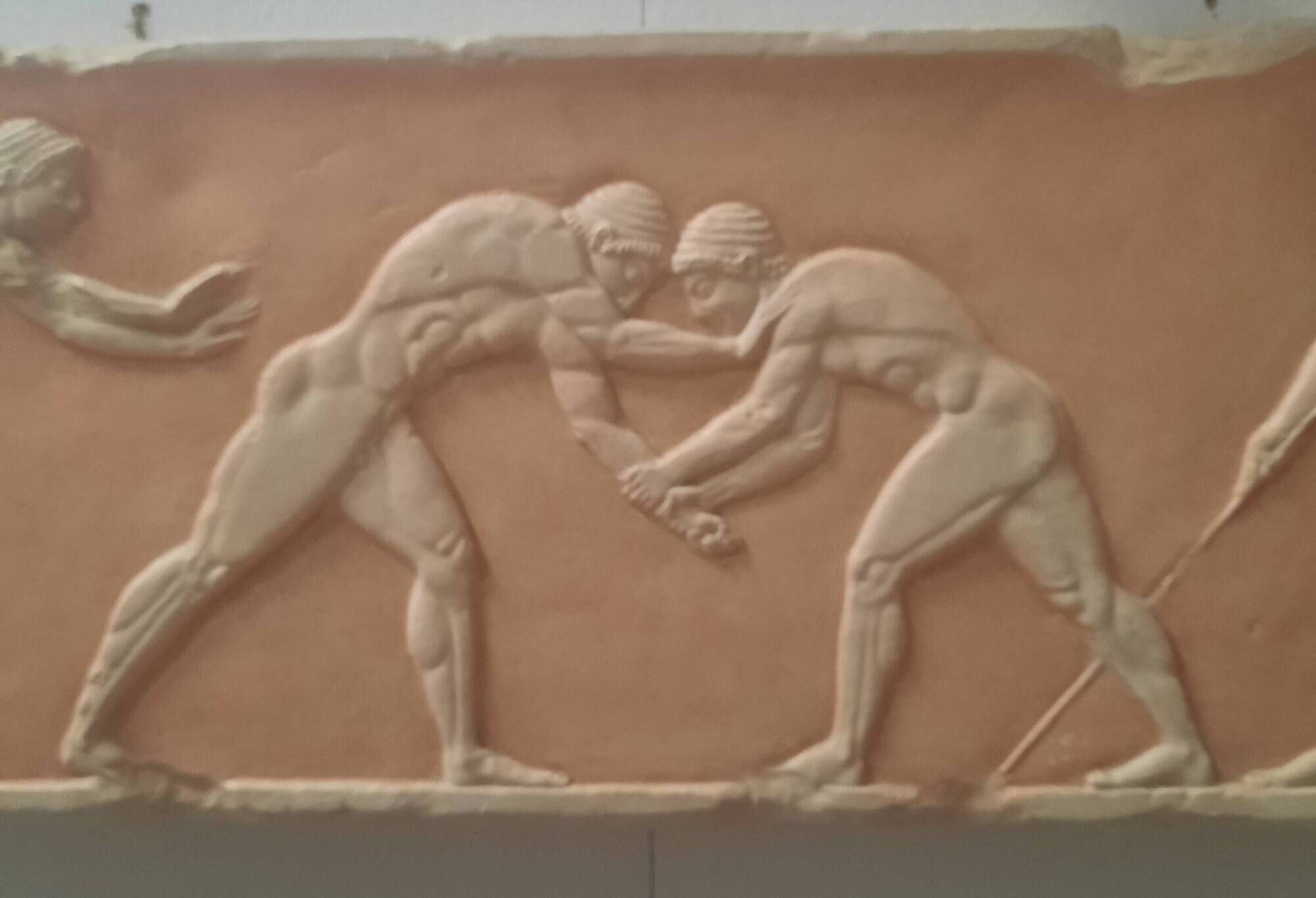 Bas-relief in the antique style featuring athletes.