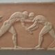 Bas-relief in the antique style featuring athletes.