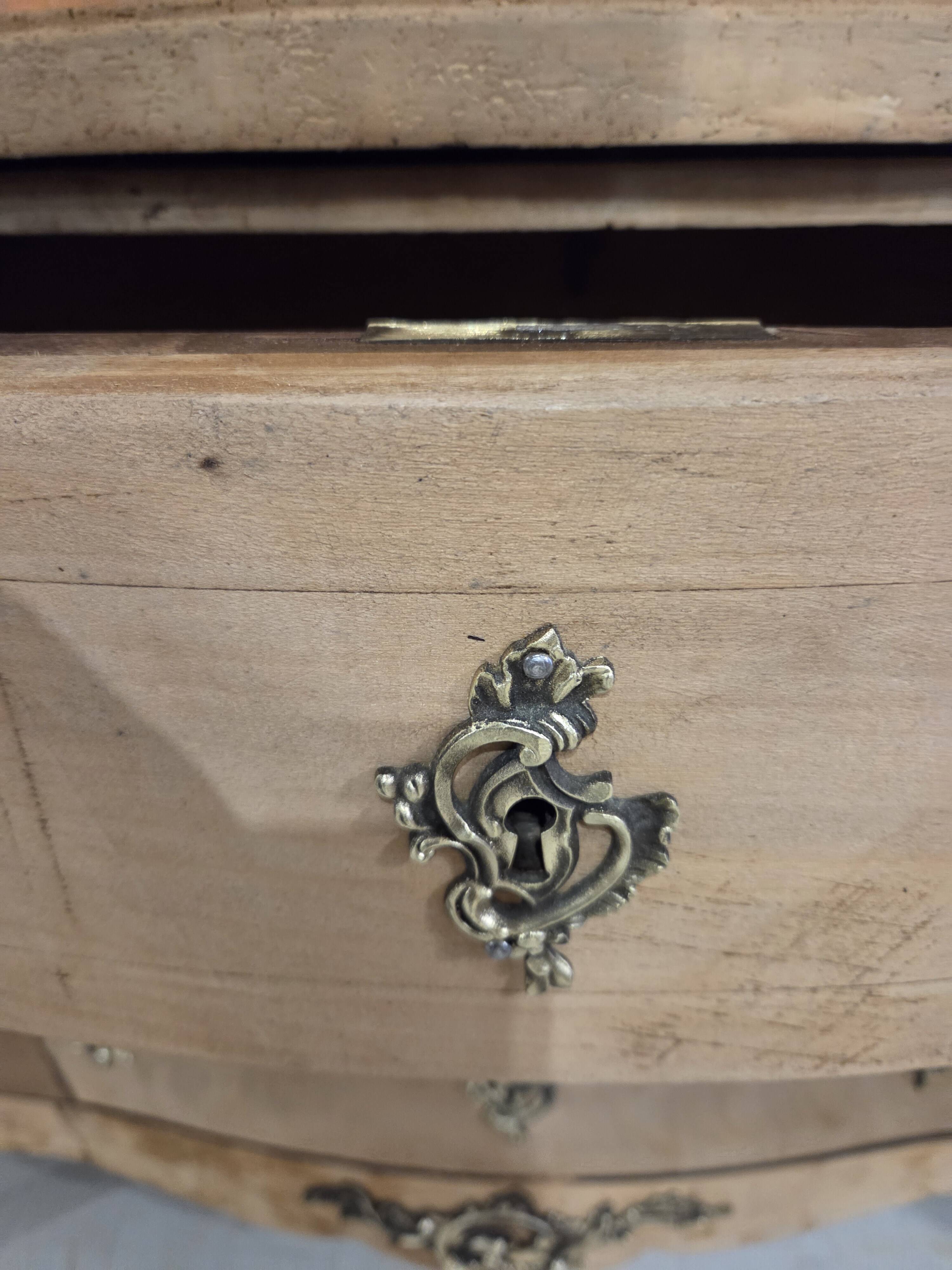 Stripped chest of drawers with bronze handles