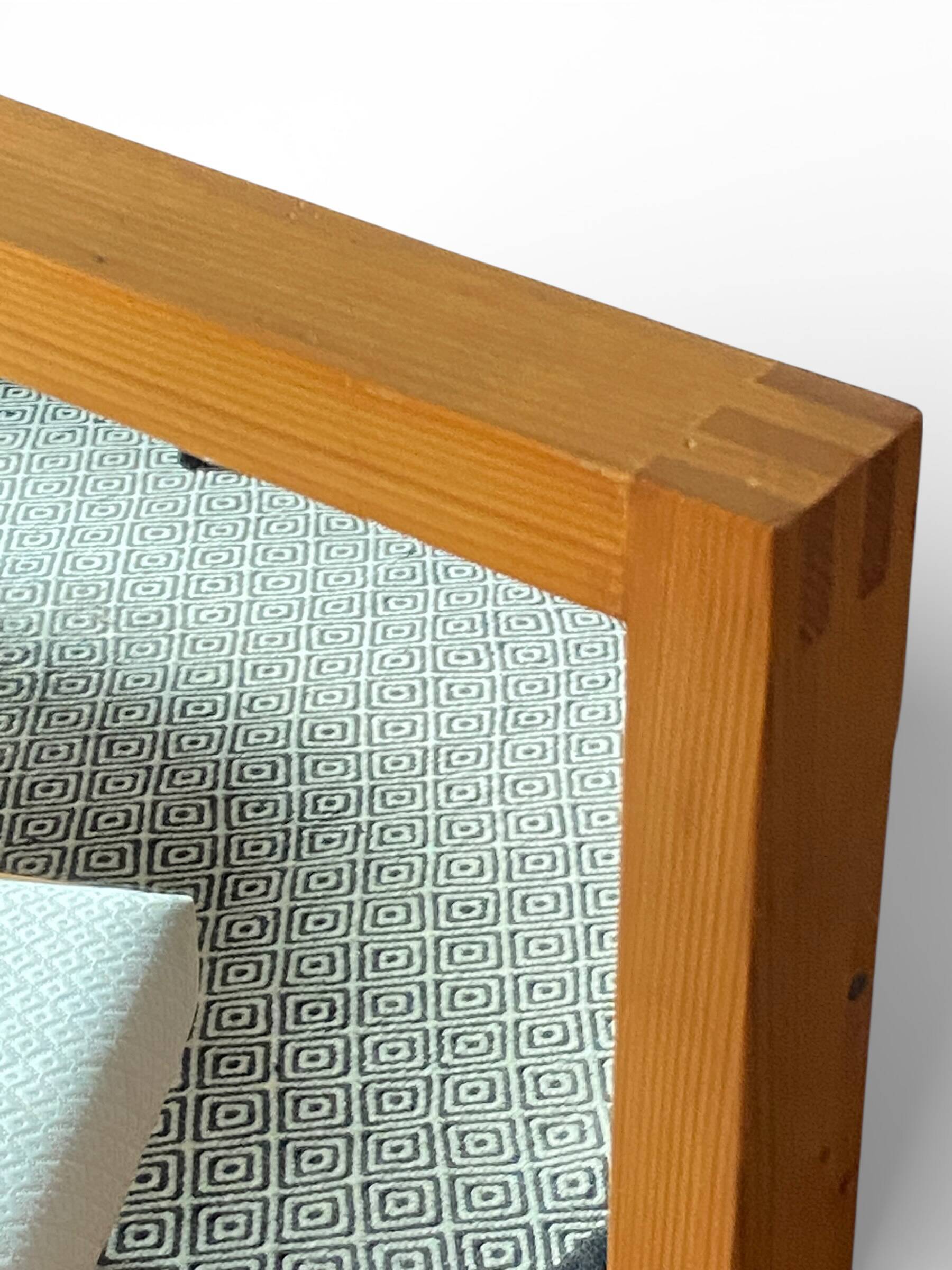 Modernist mirror in solid elm from the 1950s.