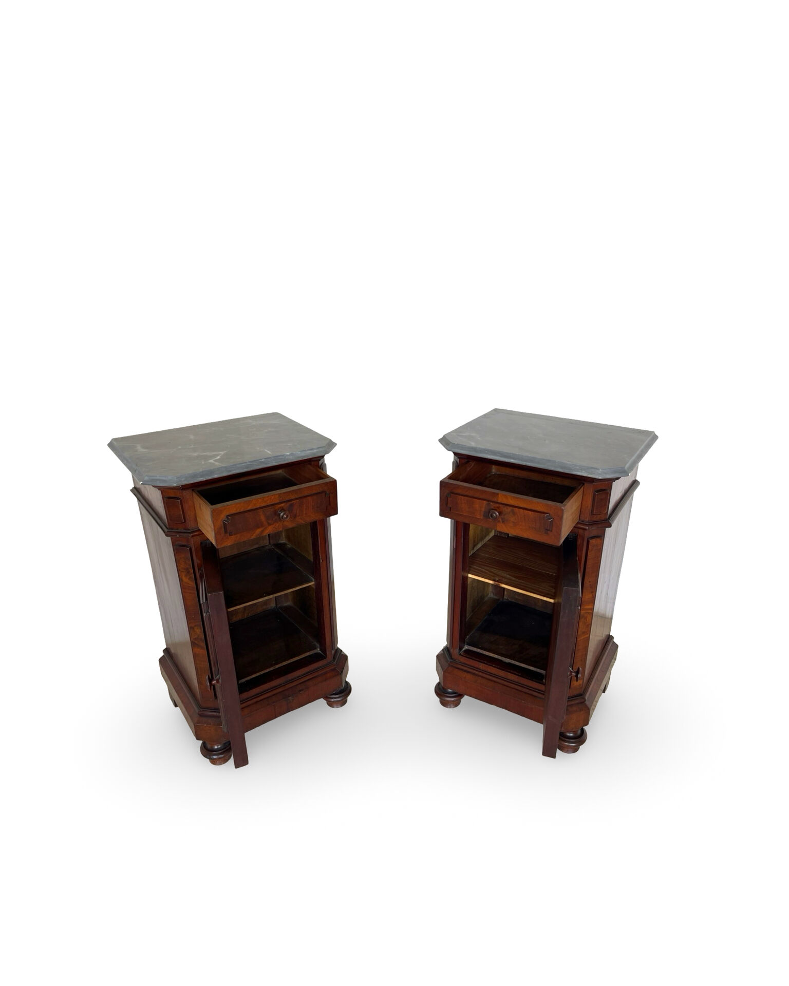 A pair of antique walnut bedside tables from the 1890s.