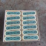 Set of 12 knife holders in green and beige glazed ceramic, slip,