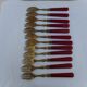 Twelve bakelite handle cake forks