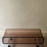 Smoked plexiglass coffee table on wheels, Roche Bobois design 1970.
