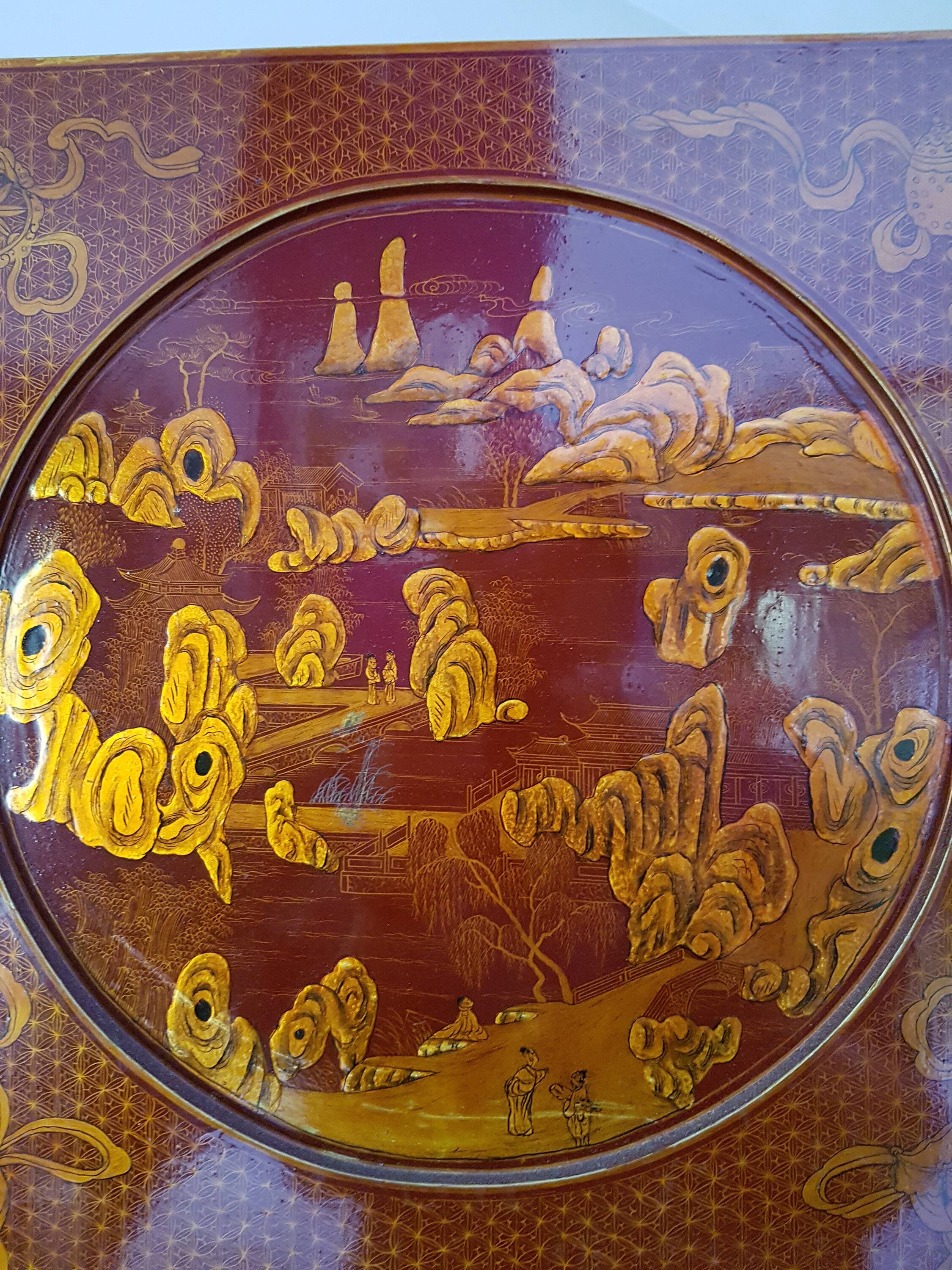 Four-panel Japanese-style screen in red and gold lacquer.