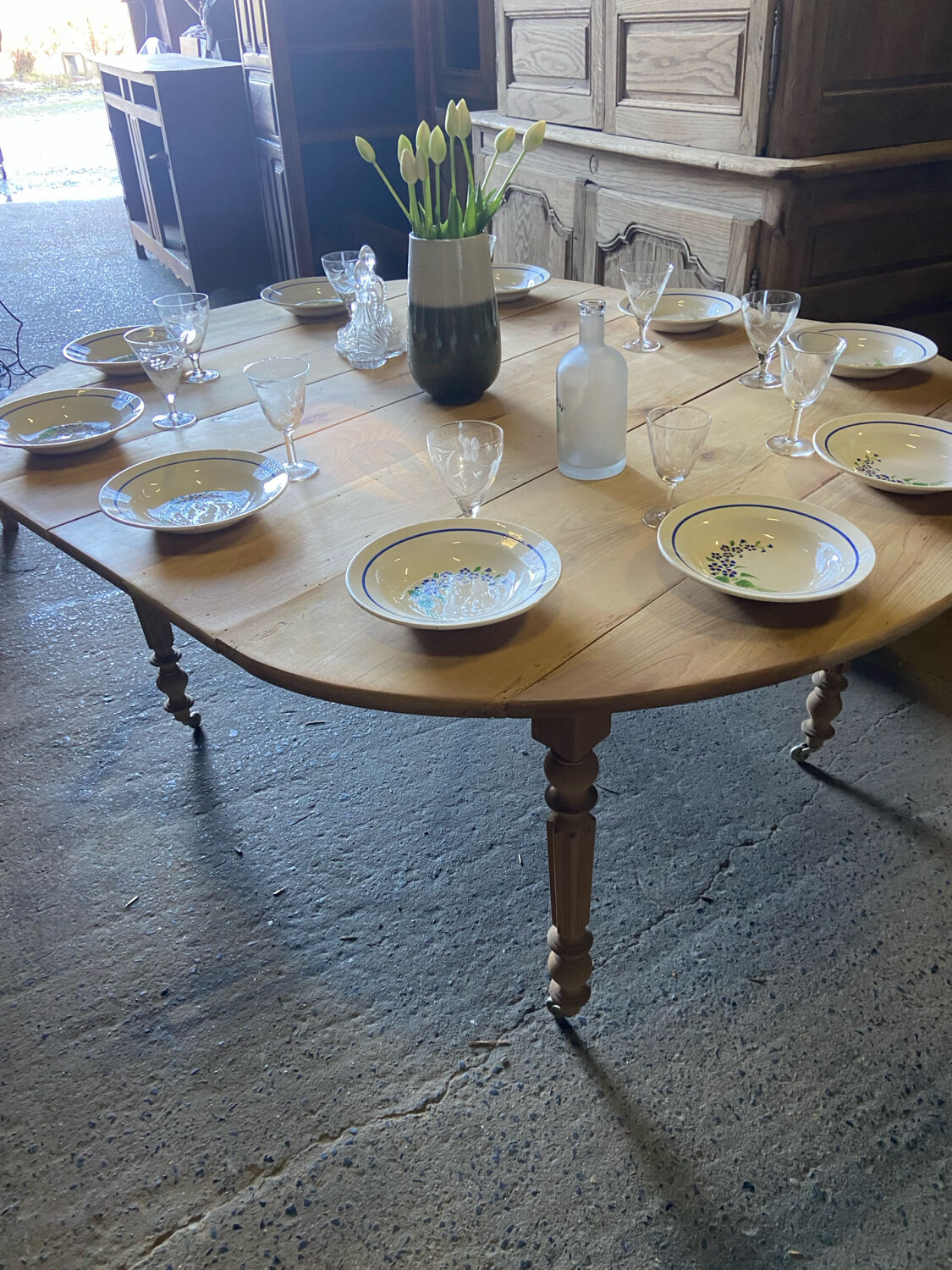 Oval wooden table on wheels.