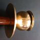 Two vintage wooden and brass candlesticks.