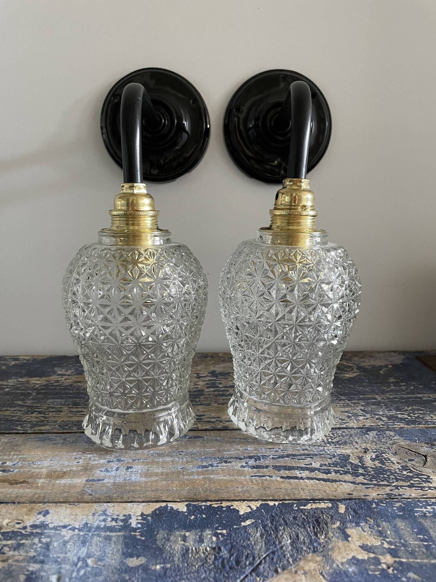 Pair of vintage electrified to nine-piece chiseled glass wall lamps