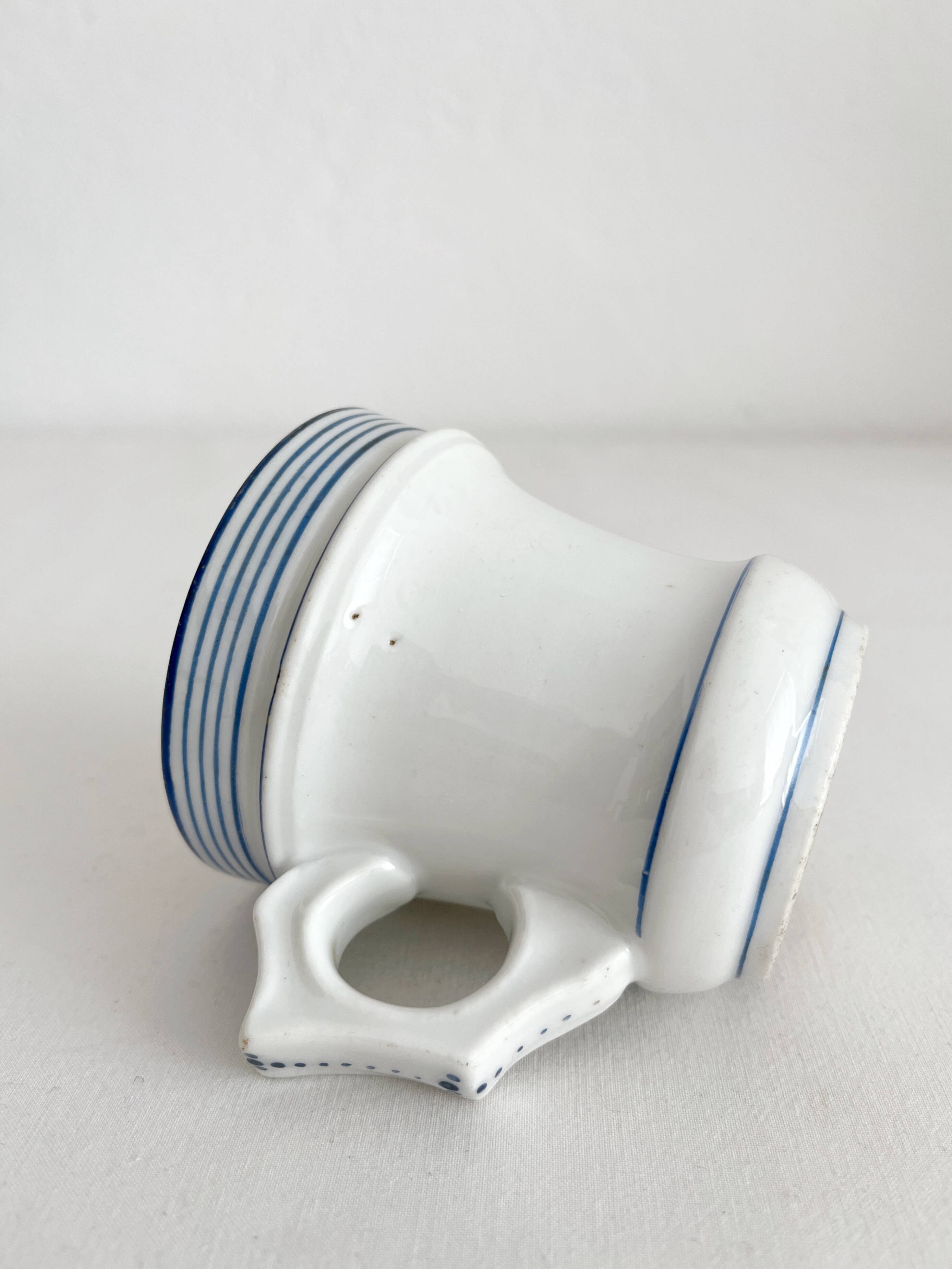 Antique porcelain teacup with blue rims, 19th century