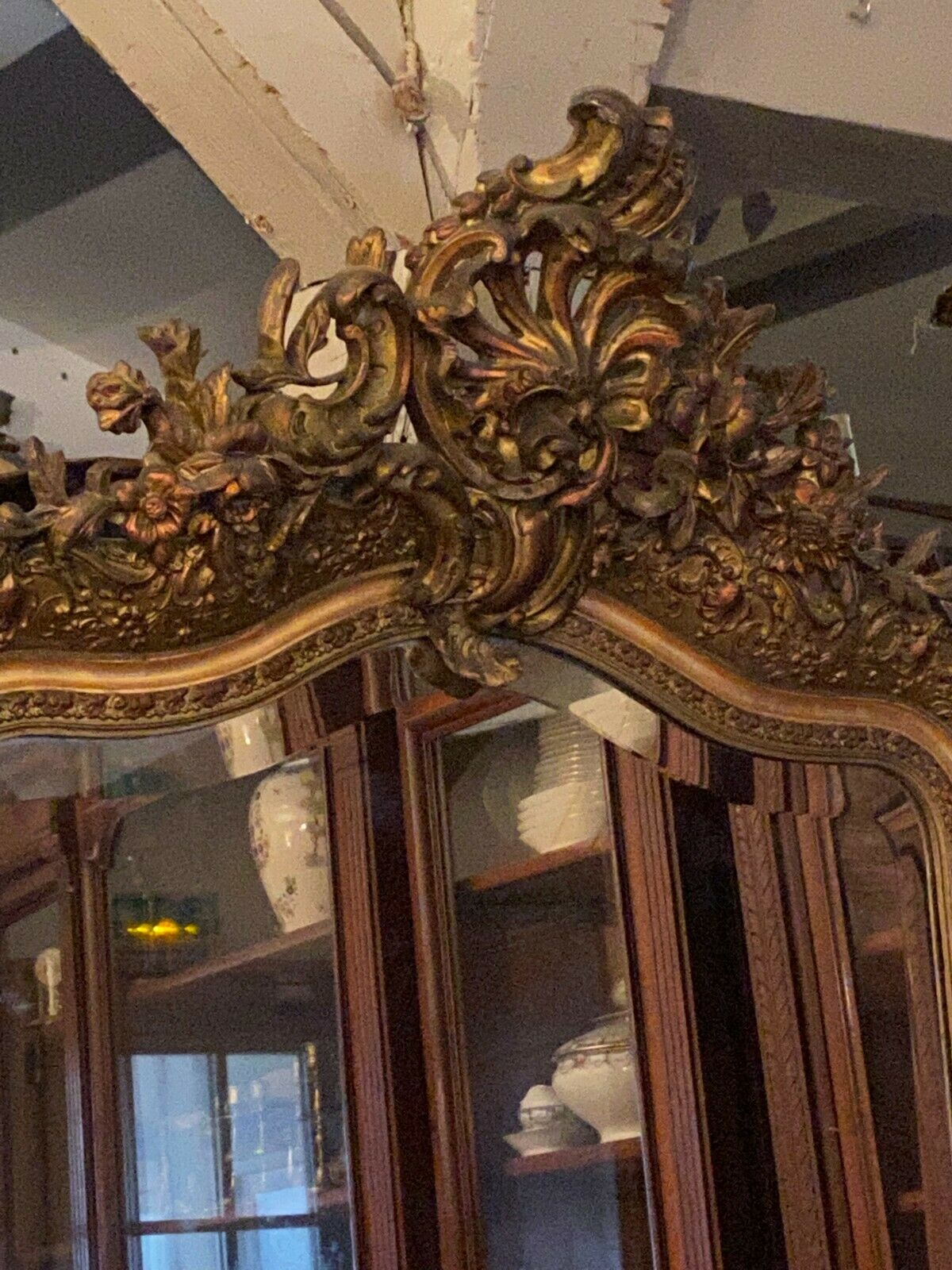 Golden mirror with bevelled ice pediment in Regency style