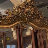 Golden mirror with bevelled ice pediment in Regency style