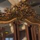 Golden mirror with bevelled ice pediment in Regency style
