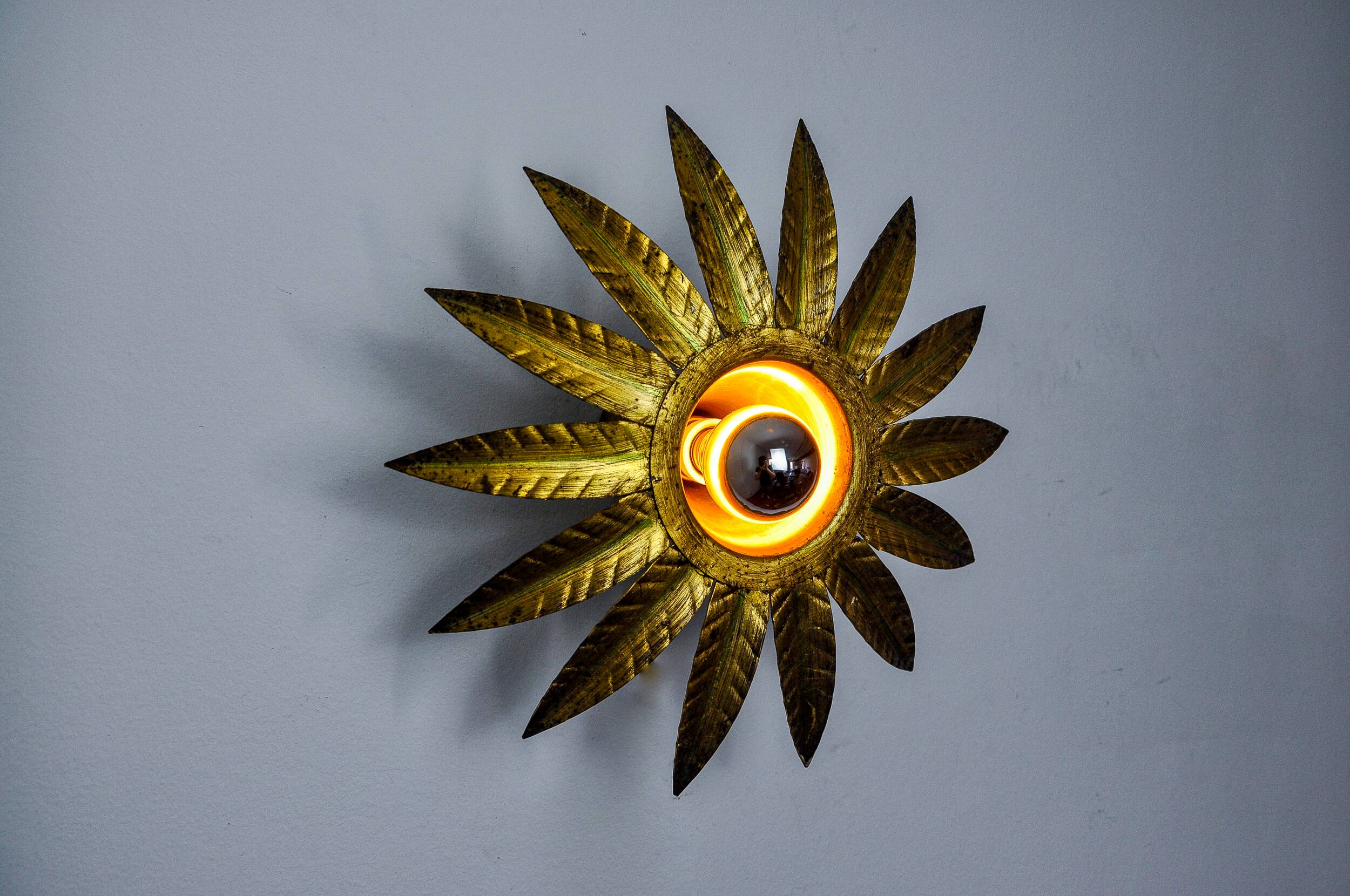 Sun wall lamp by ferro arte, metal and gold leaf, Spain, 1960